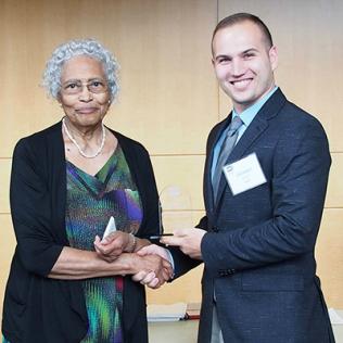 Hughes shakes hands with Cook