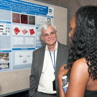 Gottesman smiles as Tanner explains her poster