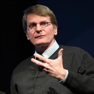 Close-up of Dr. Eric Pamer at podium