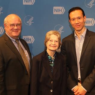 Dr. Sieving poses with Drs. Sayer, Wong