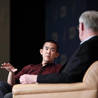 Author Ed Yong on stage with NIH director Dr. Francis Collins at the Big Read event.