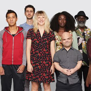 A diverse group of people standing together.