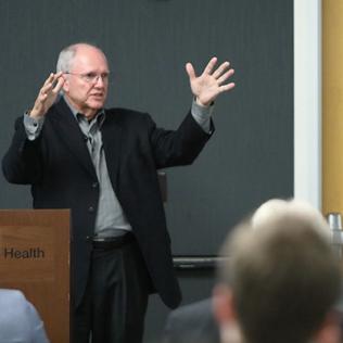 Craig Mundie speaks at the workshop.