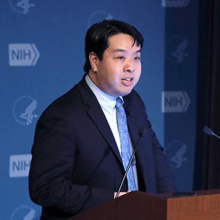 Dr. Chiu stands at a podium