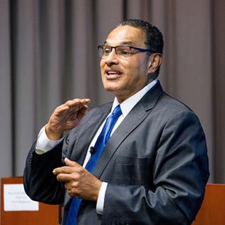 Dr. Freeman Hrabowski is speaking at lectern.