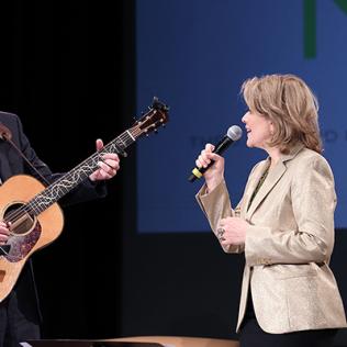 Collins sings a duet with Fleming