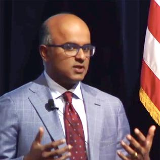 Dr. Sekar Kathiresan at podium