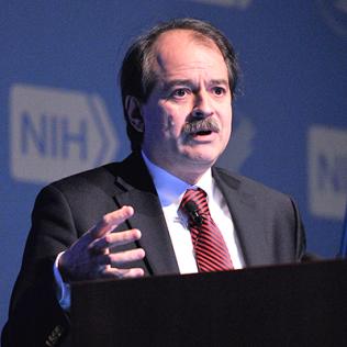 Ioannidis gestures from podium