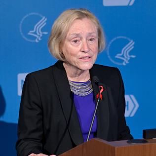 Dr. Goodenow speaks at podium.