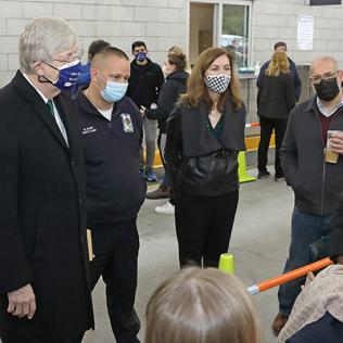 Dr. Collins, assistant fire chief Mike Gilroy and ORS director Colleen McGowan thank staff.