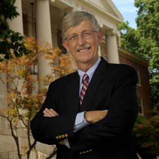 Collins stands in front of Bldg. 1