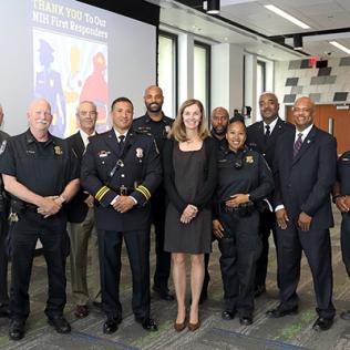 Large group of people, some in uniform