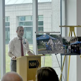 Cullinane speaks at a podium