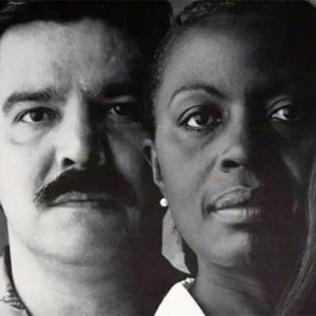 Black and white photo from poster of a Latino man with African American and Native American women