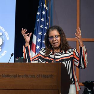 Dr. Lincoln speaks at a podium