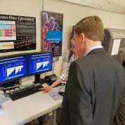 Sen. Warner looks at lab data.