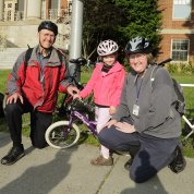 A family enjoys biking to work.