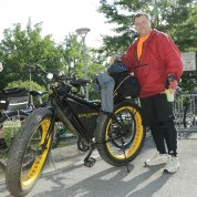 Man shows off his e-bike.
