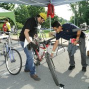Technician repairs bike.