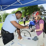 Policeman registers a bike.