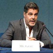 Gray speaks at a podium