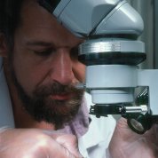 Dr. Daly at a microscope
