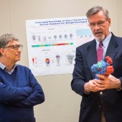 Gates and Dr. Graham examine 3-D model.