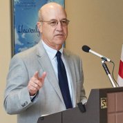 Dr. Gilman speaks at podium