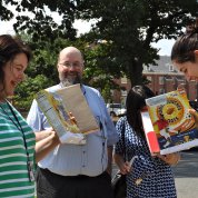 Staff look at the eclipse through cereal boxes