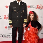 Surgeon General Jerome Adams and daughter Millie pause for a pic on the red carpet.