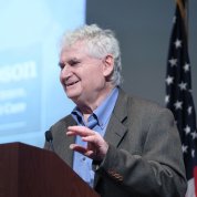 Pastan speaking at podium