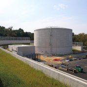 The IWSS is flanked by a massive concrete retaining wall, with parking lot 42 adjacent to it.