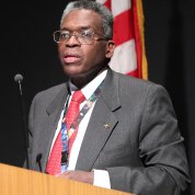 OIR's Dr. Roland Owens speaks at podium