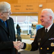 Collins, left, shakes Giroir's hand
