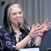 Kubu gestures at the mic.