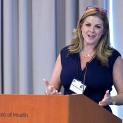 Monica Weldon speaks at podium.