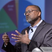 Dr. Gibbons with outstretched hand shares his perspective.