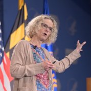 Dr. Nora Volkow talks from stage with outstretched arm