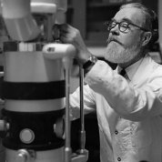 Cole tends to an apparatus in his lab.