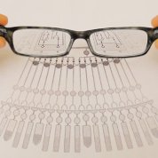 Image of eyeglasses magnifying a diagram.
