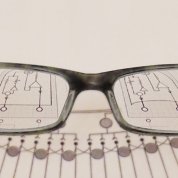 Image of eyeglasses magnifying a diagram.