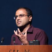 Dr. Shroff speaks at podium.