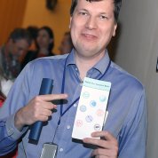  Stefanov holds up his data science passport