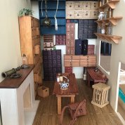Miniature lab room with quarter coin on floor in foreground for scale 