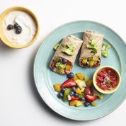 Two veggie wraps and fresh fruit