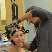 A research participant is prepared for fNIRS.