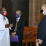 Wright, Pérez-Stable, and Collins, in face masks, chat informally.