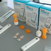 The test includes a sterile Nasal Swab, a Dropper, Processing Fluid, and a Bluetooth® connected Analyzer