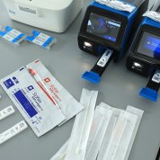 A small bench top analyzer and nasal swabs