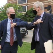 Van Hollen greets Collins with an elbow bump instead of a hand shake